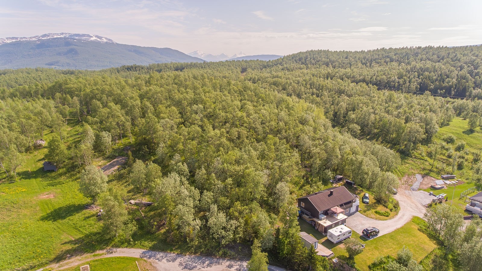 001_Tomt med bra beliggenhet øverst i boligfelt i Finnfjordbotn, med fin utsikt og god solgang..jpg Galleribilde