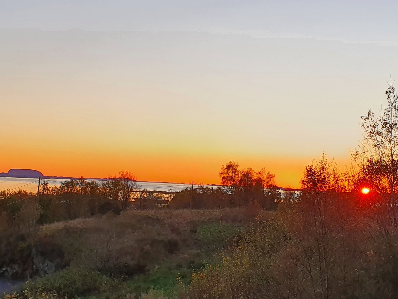 Vinterbilde med solnedgang i havet i over 4 mnd. Galleribilde