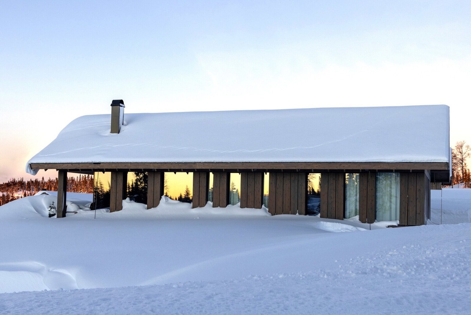 Hyttemodellen Vy glir inn i landskapet på en elegant måte.
Foto fra et annet prosjekt Galleribilde