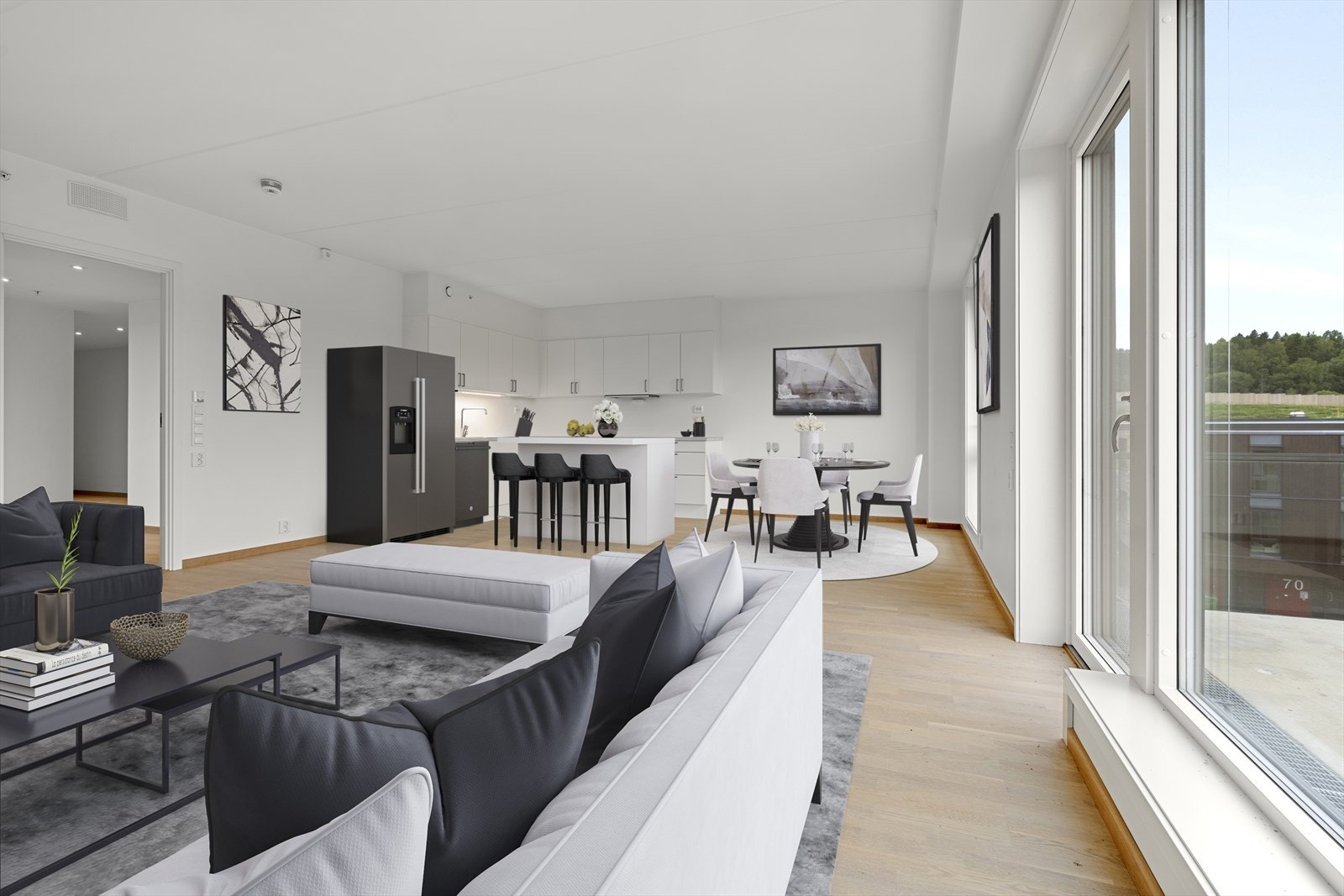 Leiligheten har en stor og åpen stue/kjøkken løsning med utgang til balkong. (Illustrasjonsbilde av hvordan leiligheten kan møbleres) Galleribilde