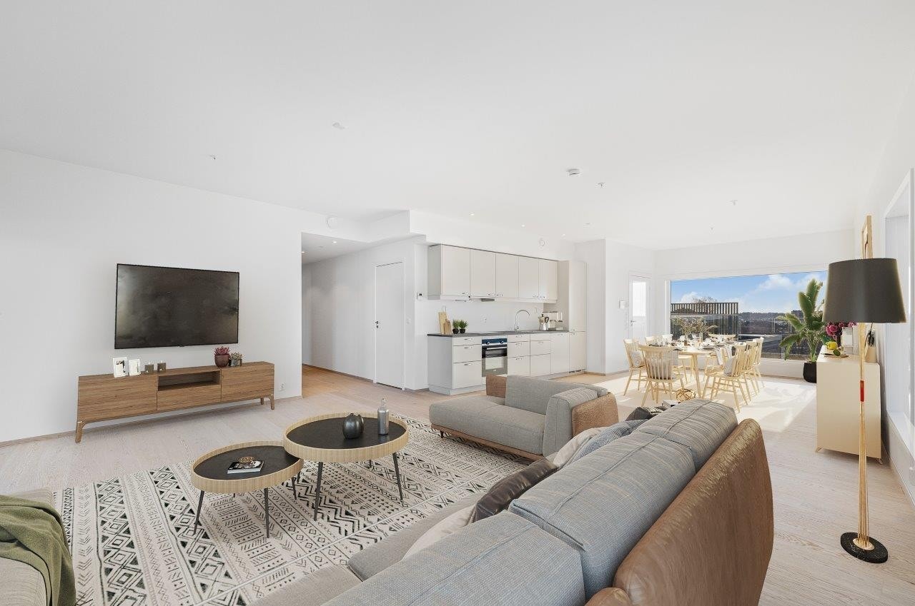 Kjøkken og stue har en åpen løsning og måler over 57 kvm Galleribilde