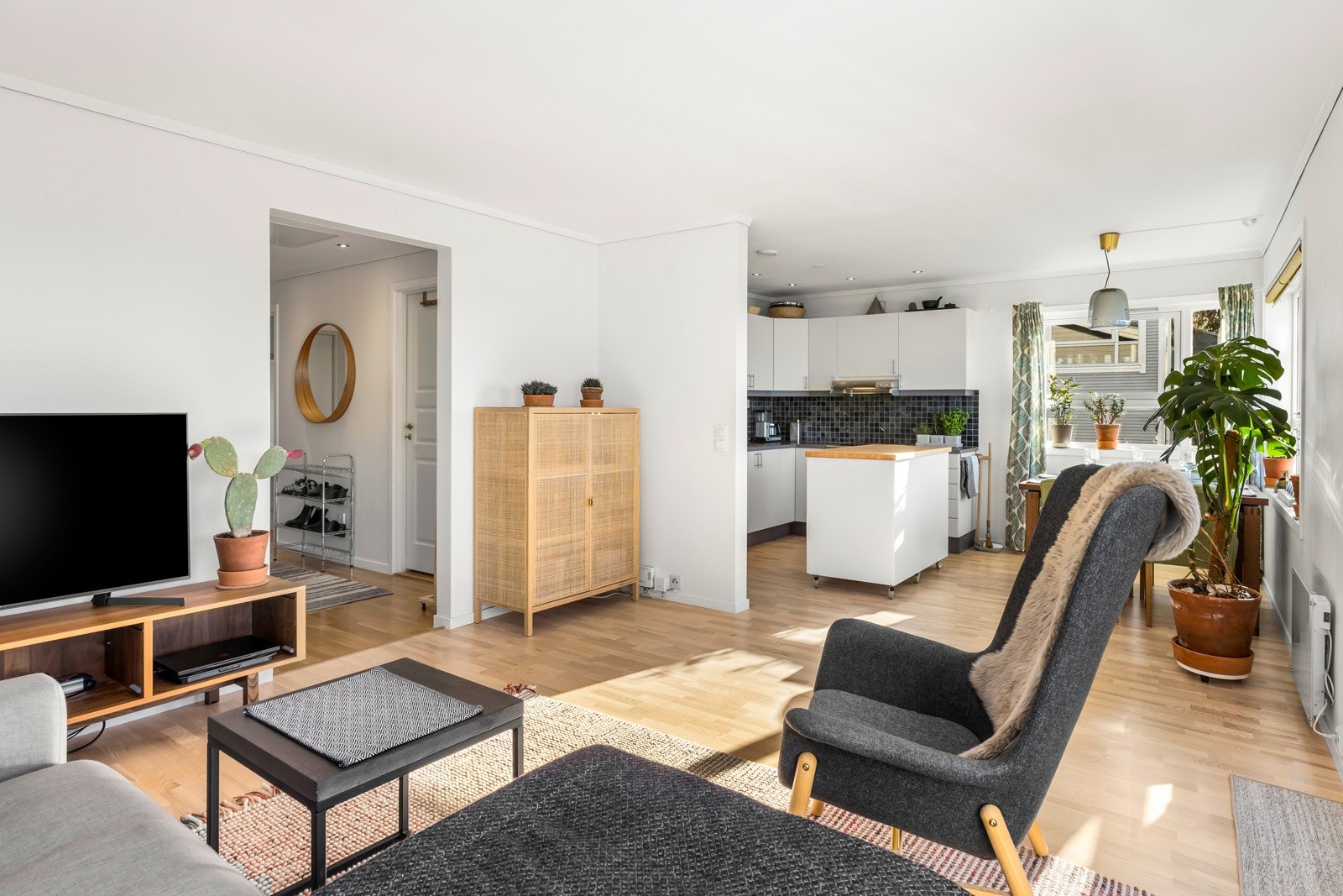 Denne stuen er ikke bare et sted for avslapning, men også for sosialt samvær og hygge - et perfekt sted å kalle hjem. Galleribilde