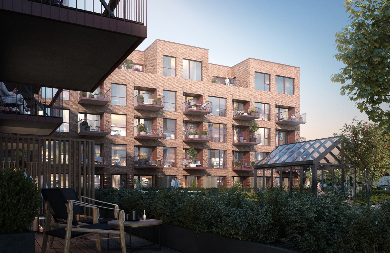 Skogmo Park fellesområde med drivhus og plantekasser sett fra terrasse i hus F Galleribilde