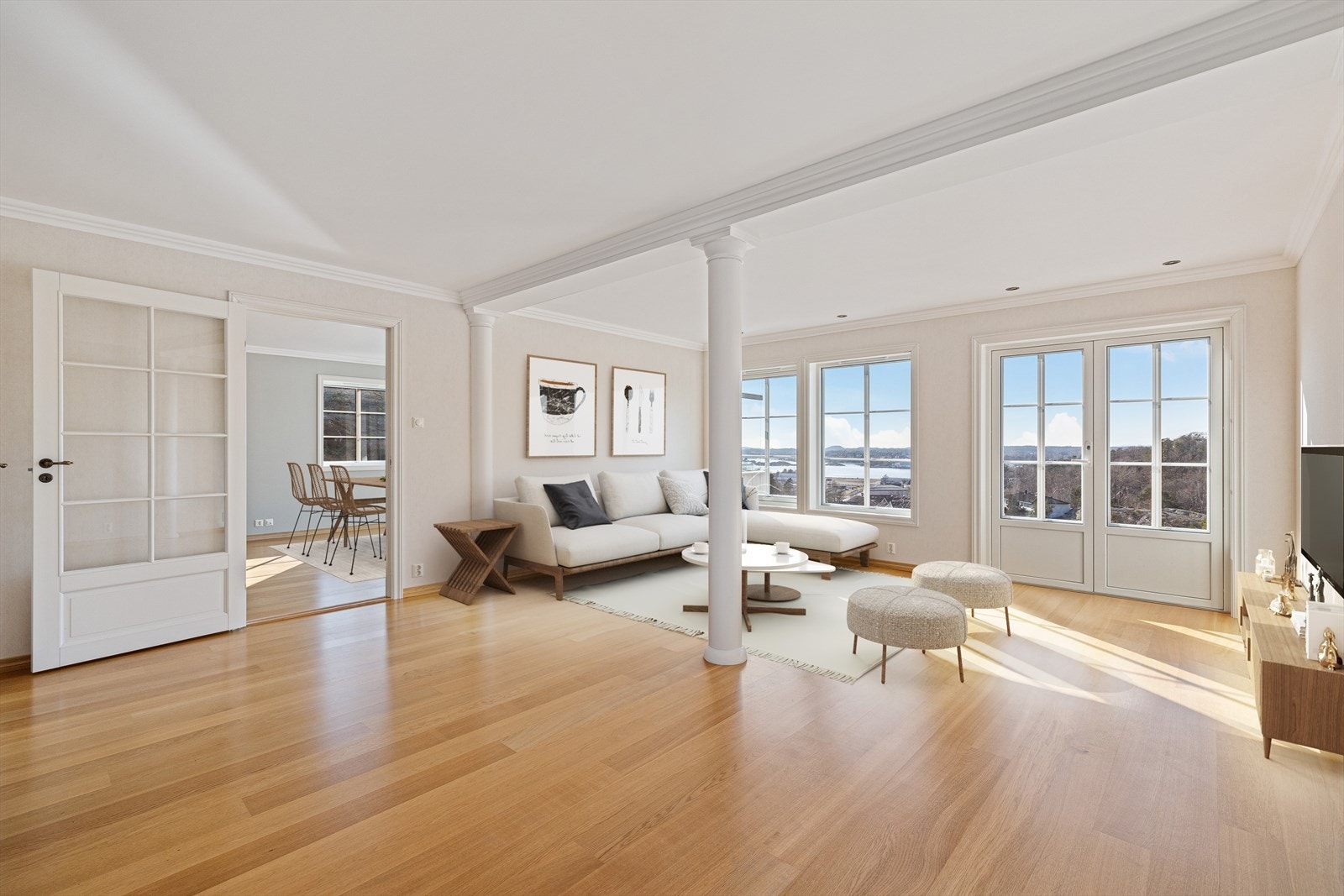 Stor, lys stue med flott utsikt mot fjorden og utgang til uteplass - Syd Galleribilde