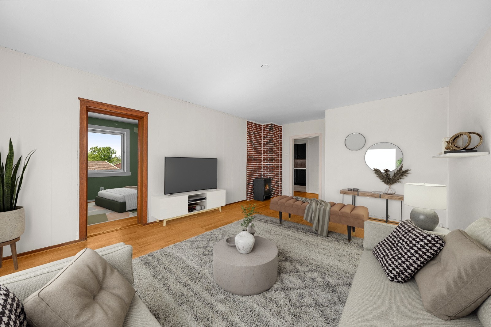 Boligens hjerterom er en lys og romslig stue (digitalt møblert). Galleribilde