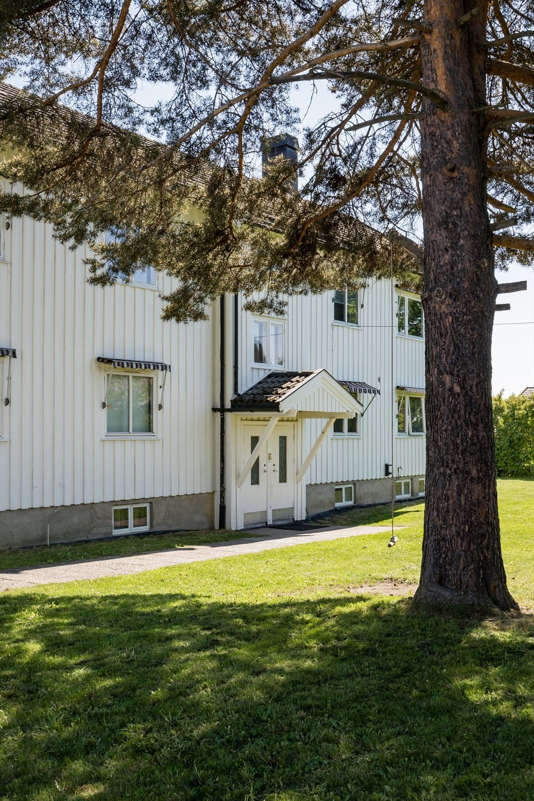 Overbygget inngangsparti ved felles inngang Galleribilde
