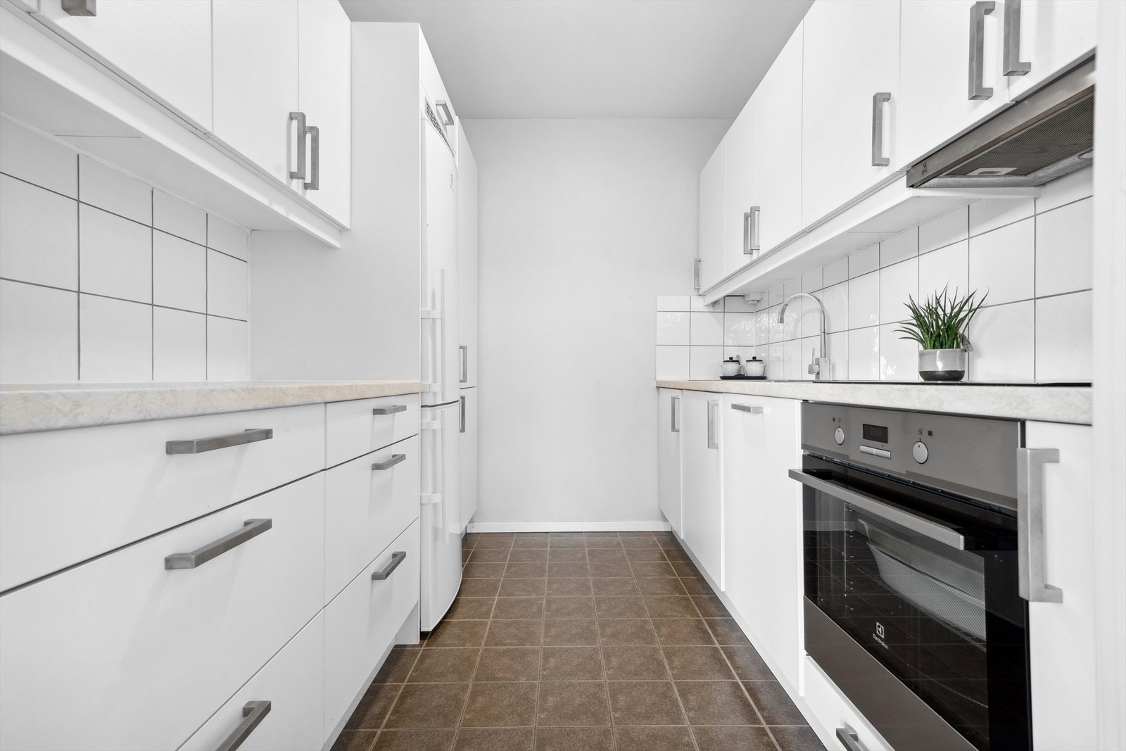 Leiligheten har et kjøkken med adkomst fra stuen, og det har en moderne design. Galleribilde
