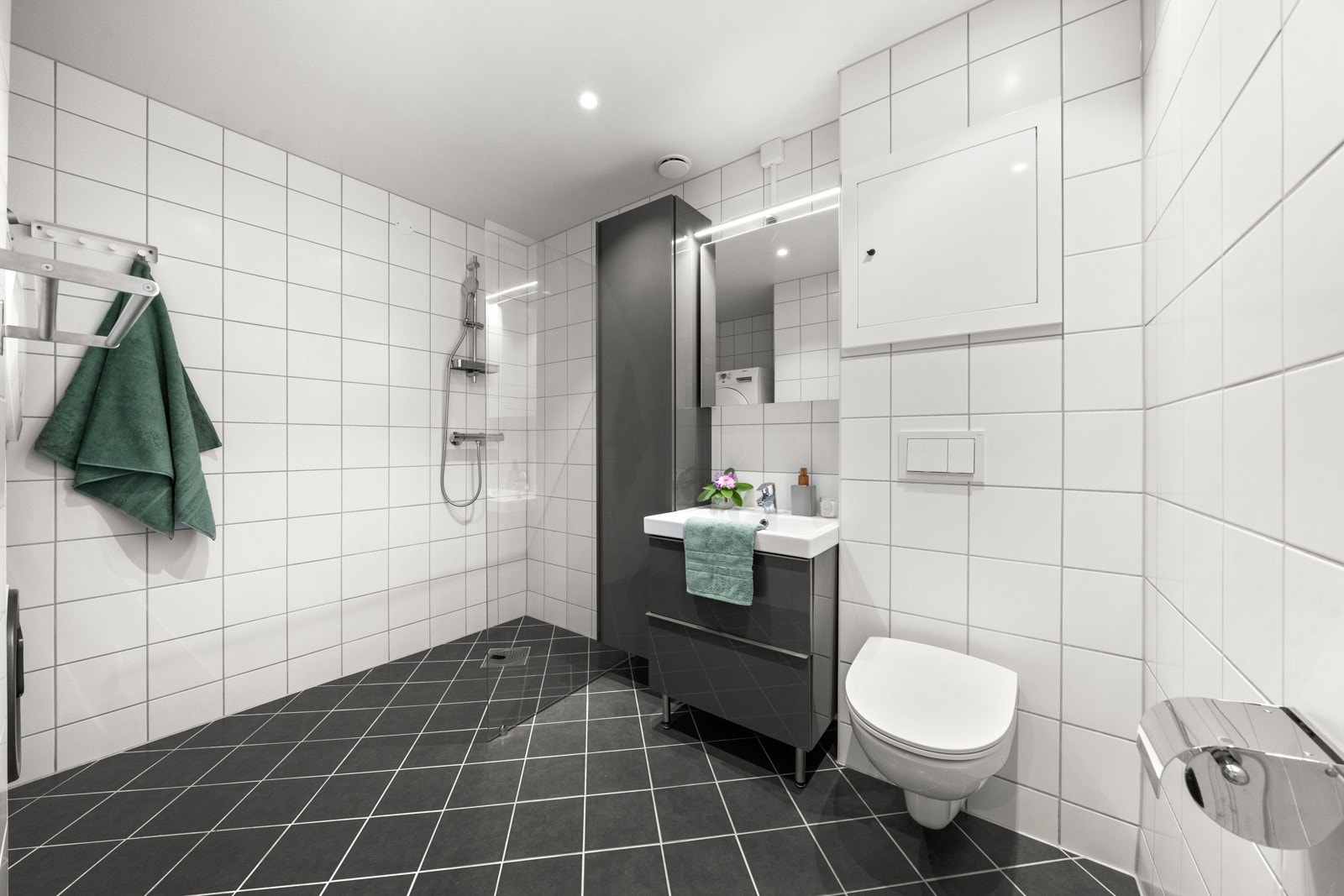 Badet er innbydende med sin moderne estetikk og lyse fargevalg som gir en følelse av ro og renhet. Galleribilde