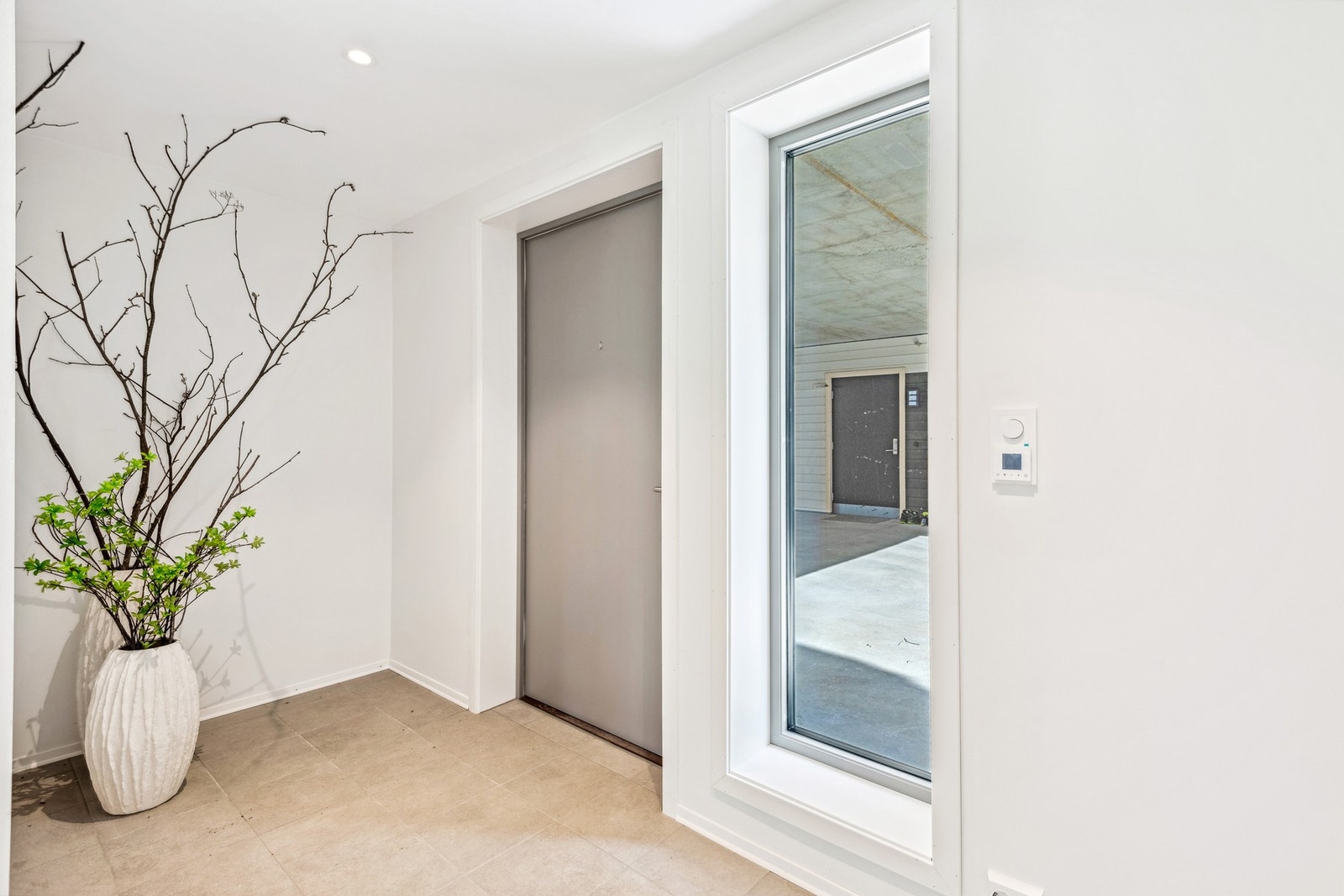 Flislagt gang med varme i gulv. Galleribilde