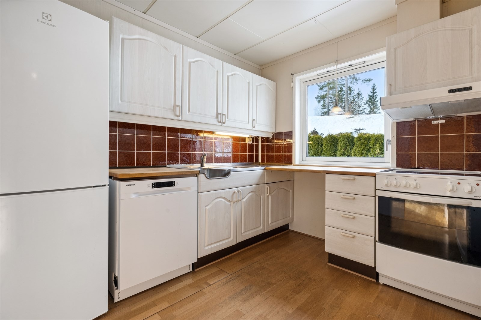 Kjøkkenet har behov for modernisering på sikt. Galleribilde