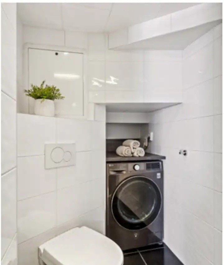 Vaskemaskin med tørketrommel. Galleribilde