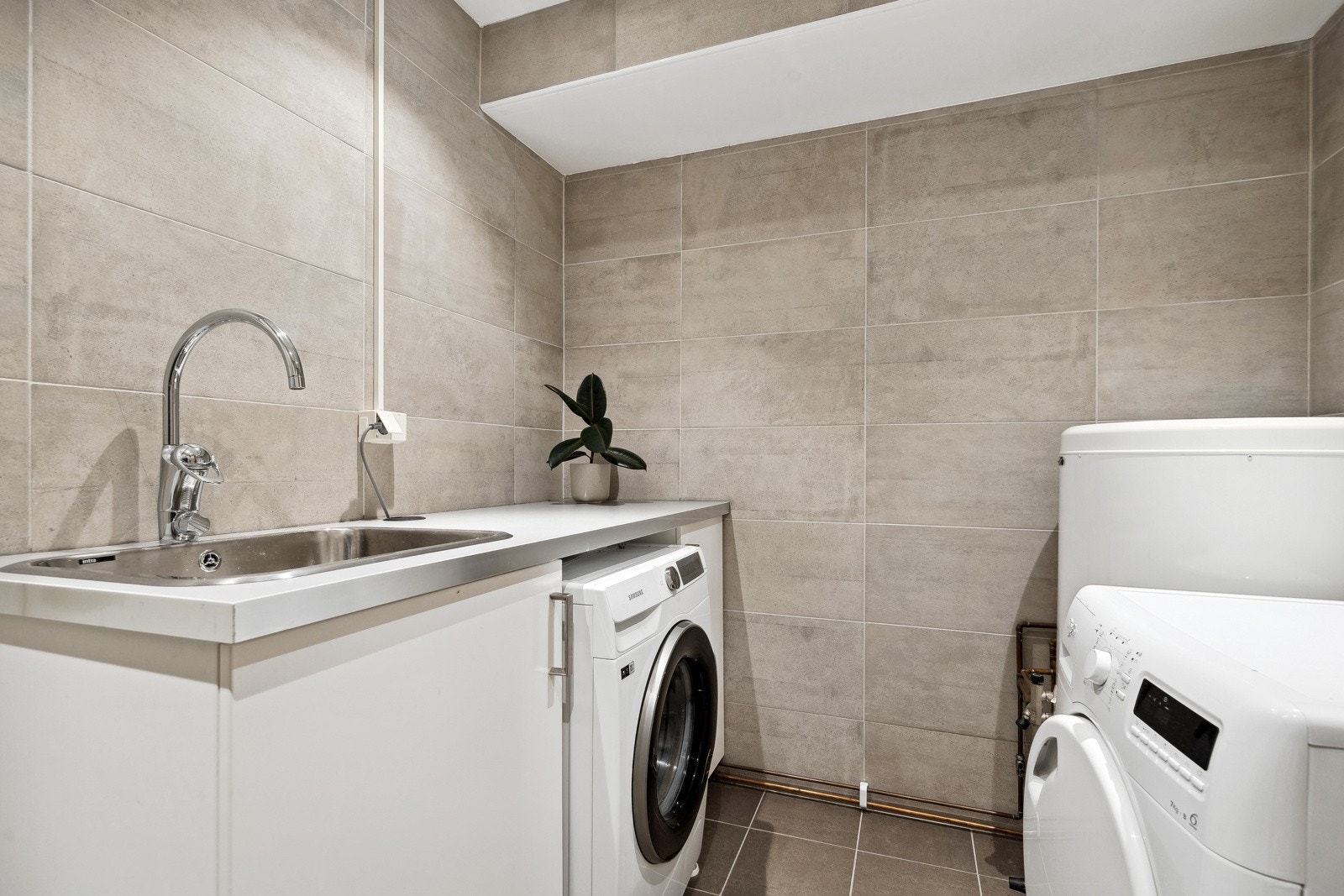 Leiligheten er også praktisk løst med eget vaskerom for en enklere hverdag. Galleribilde