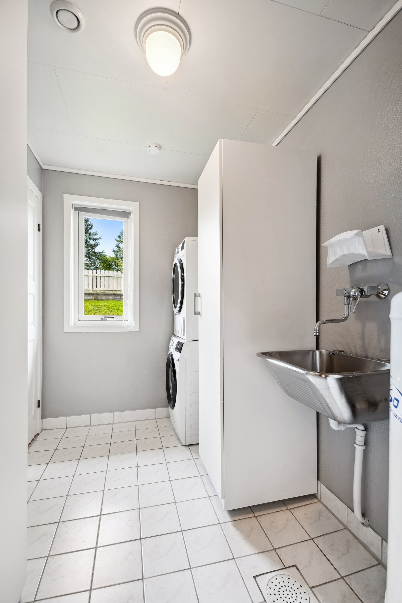 Eget vaskerom i boligen med elektriske varmekabler i gulv. Galleribilde