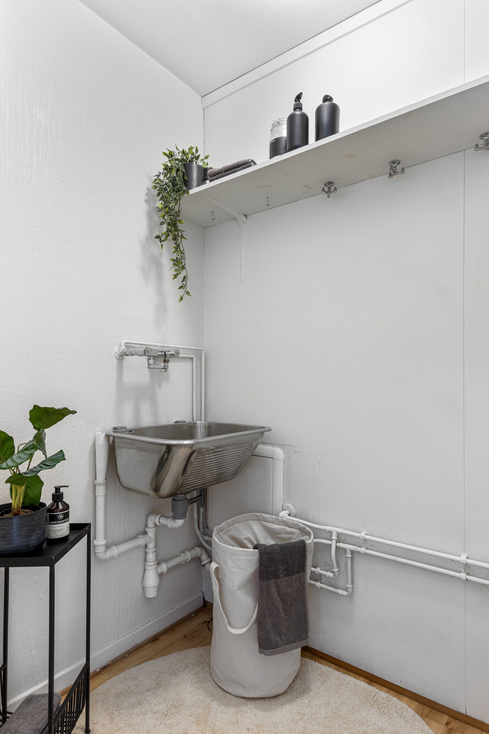 Bod som har opplegg til vaskemaskin. Galleribilde