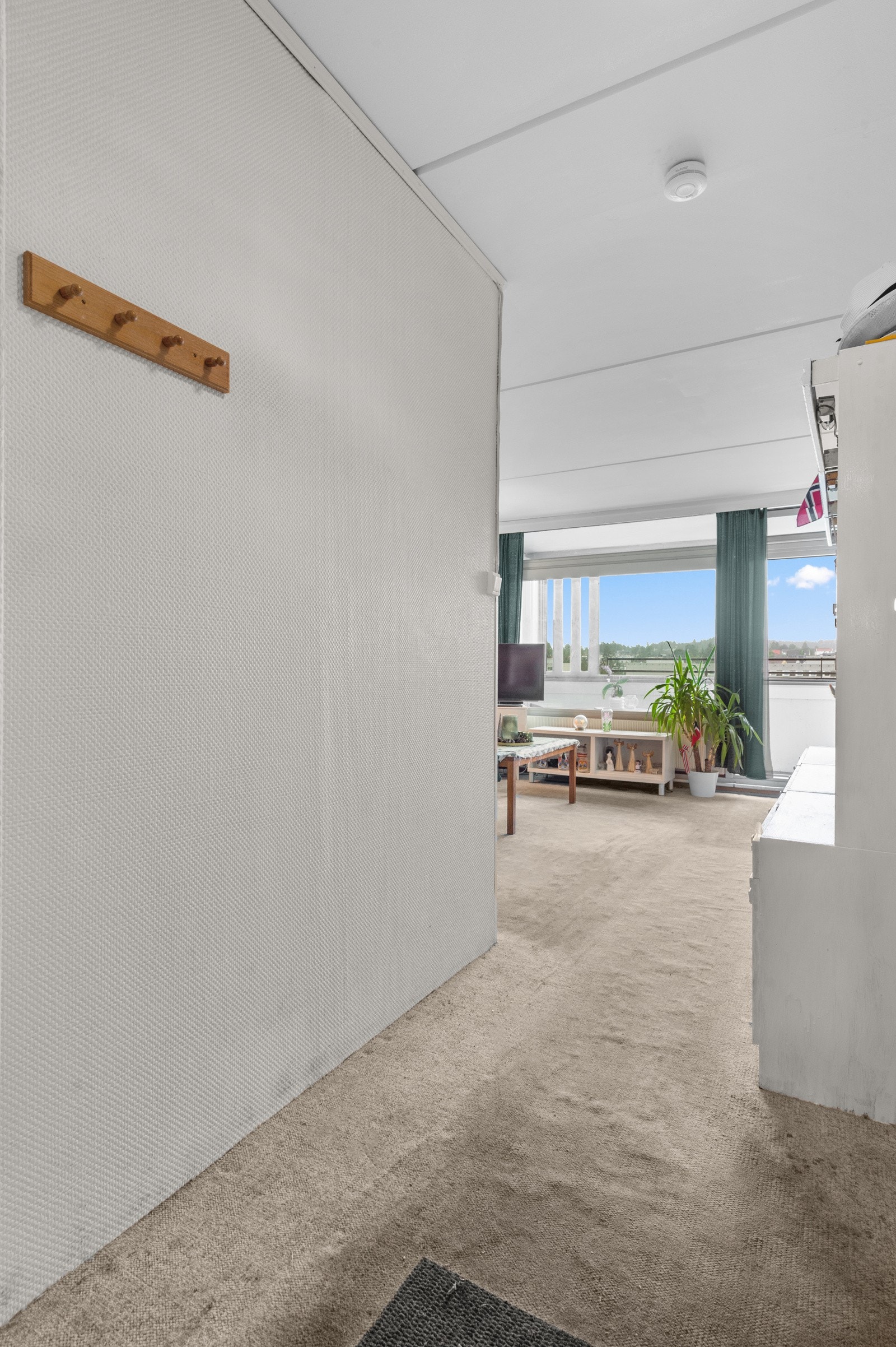 Gangen er et naturlig knutepunkt i leiligheten til de øvrige rommene i leiligheten. Galleribilde