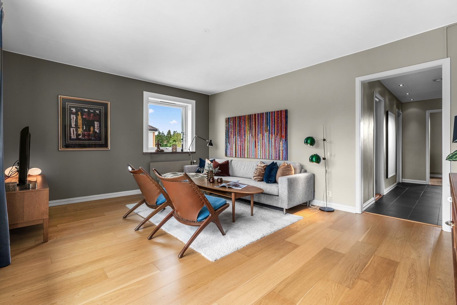 Stuen er et sosialt rom og boligens naturlige samlingspunkt. Galleribilde