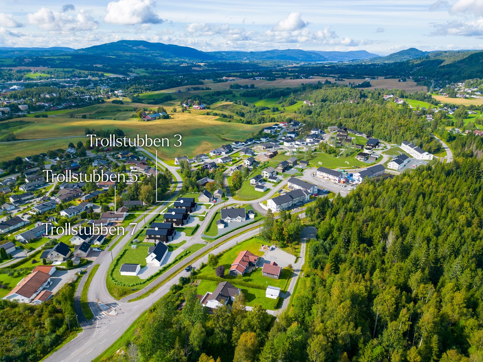 Illustrasjon av boligene i feltet, Eidsvoll sentrum i bakgrunnen til venstre. Galleribilde