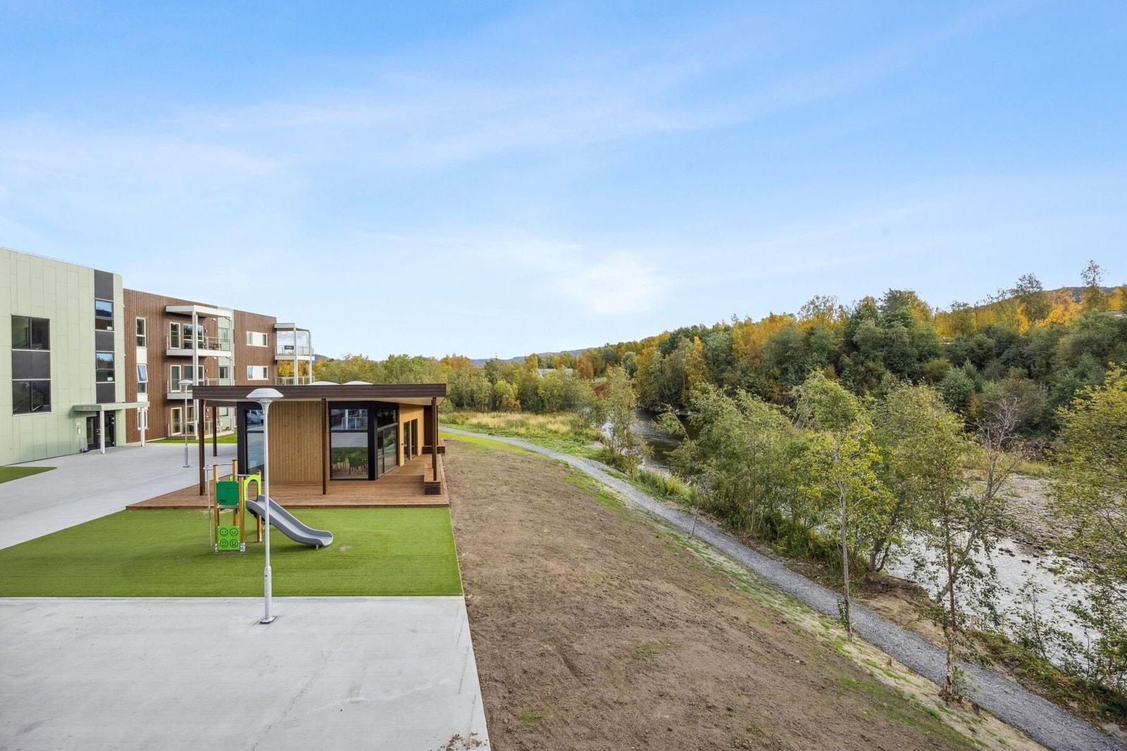 Fellesareal, lekeplass og felles utestue. Galleribilde