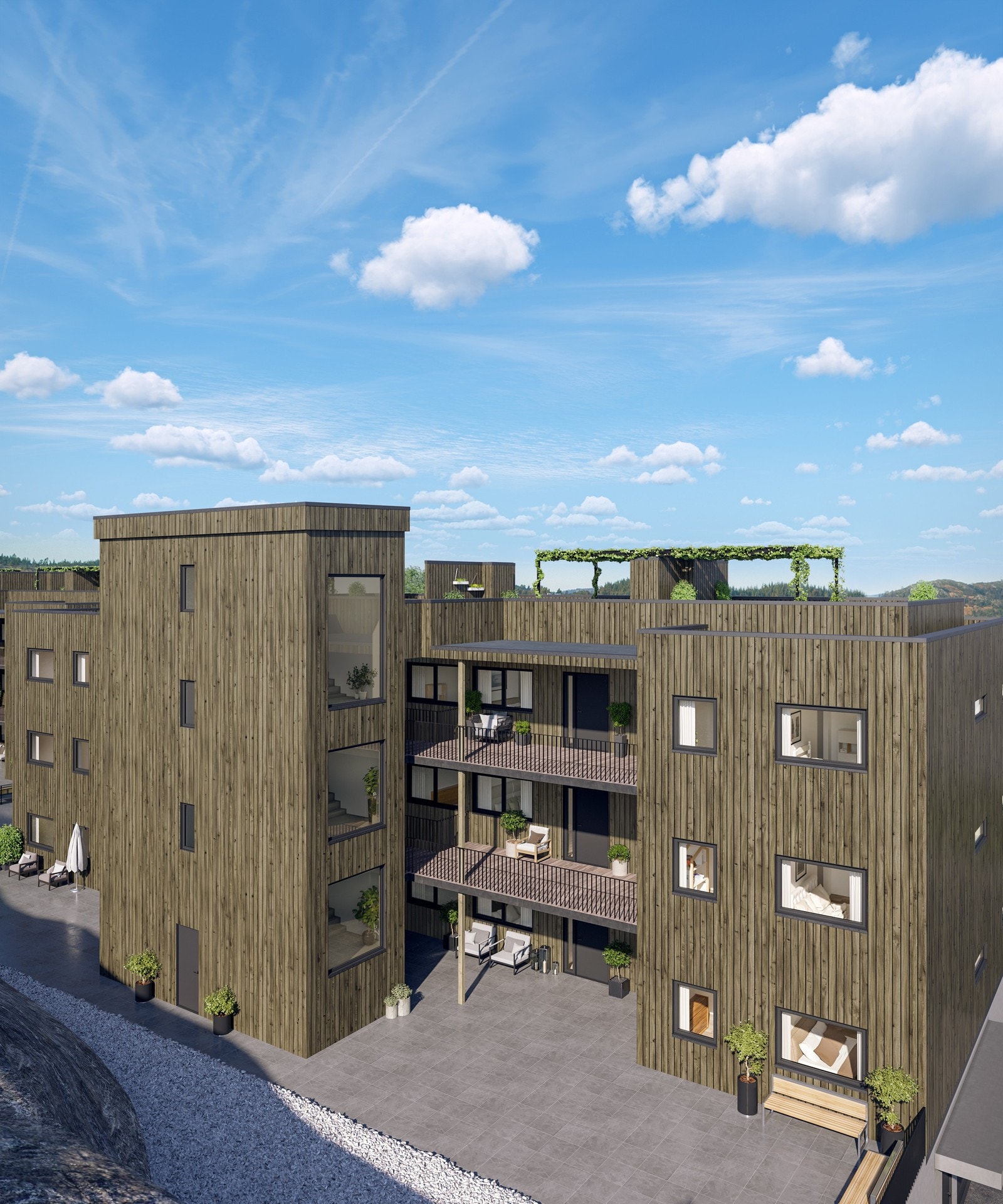 Bakside av bygg med heisbygg, og legg merke til overbygde svaleganger. Galleribilde