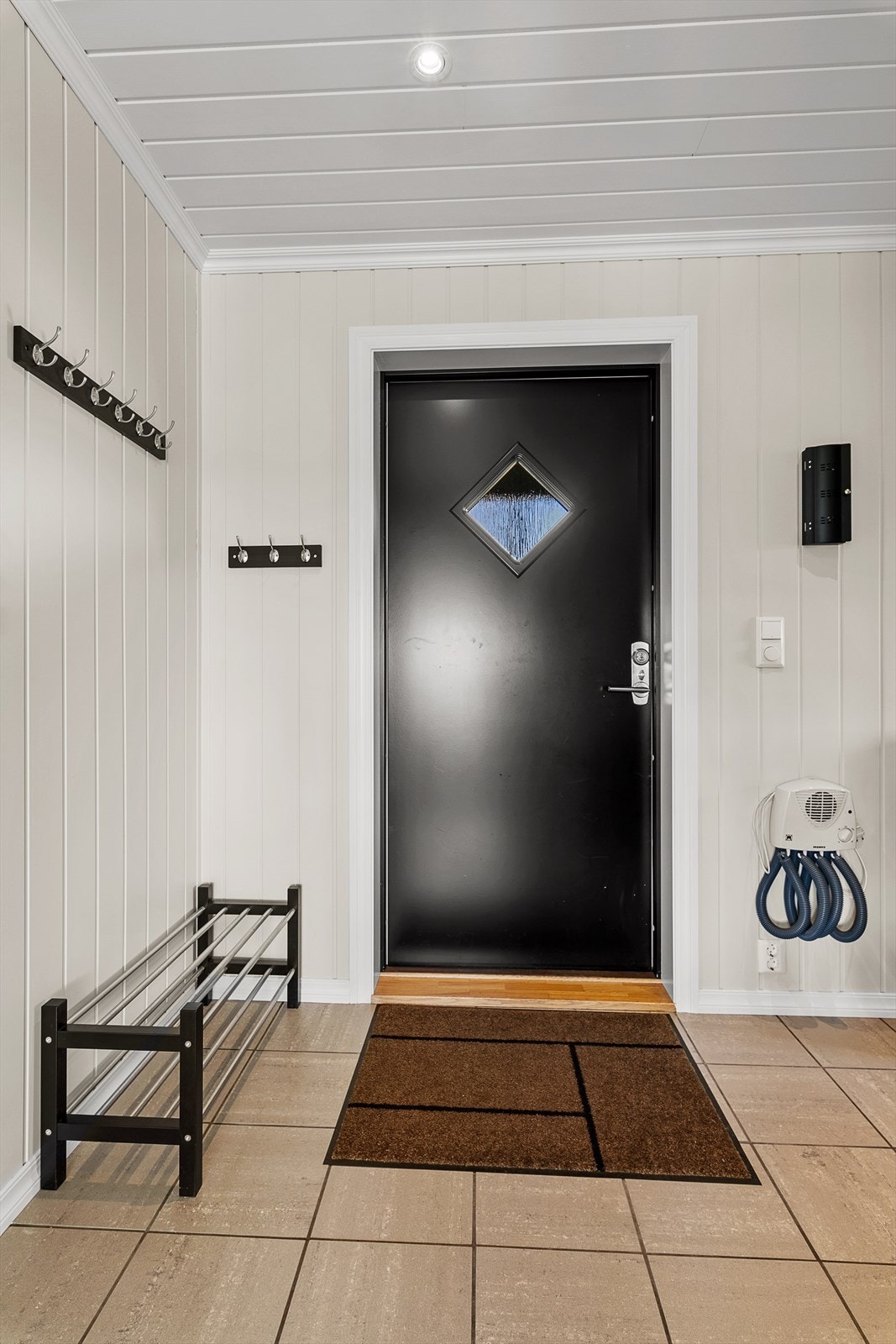 Vindfang med flislagt gulv. Galleribilde