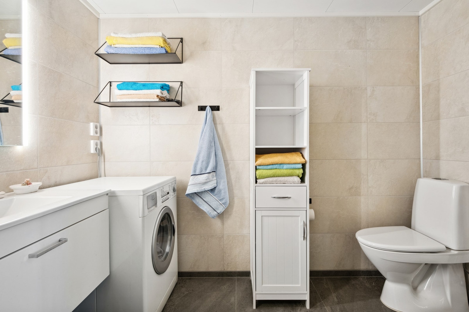 Badet har opplegg for vaskemaskin. Galleribilde