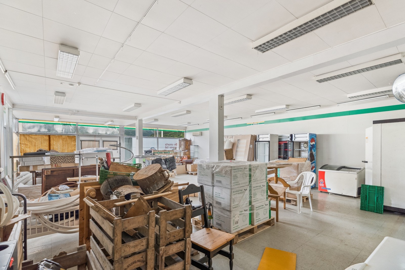 Det tidlegare butikklokalet er i dag nytta som lager Galleribilde