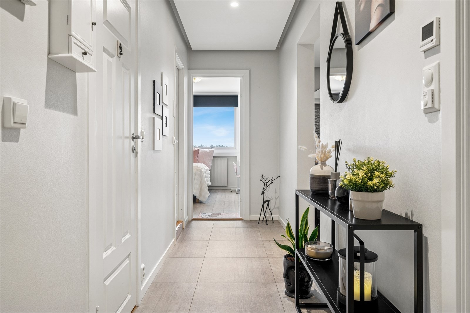 Leiligheten har en romslig entré med gulvvarme. Galleribilde