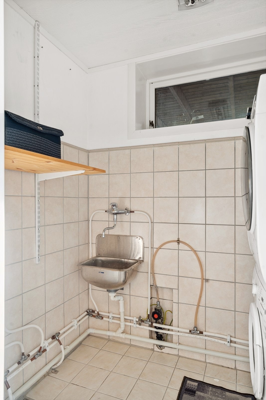 Boligen har også et separat vaskerom. Galleribilde