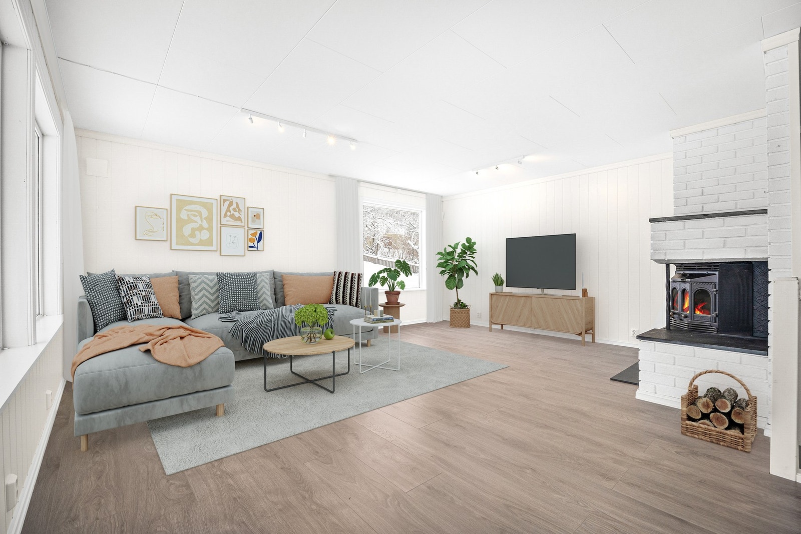 Boligen har et stort og lyst allrom med stue, spisestue og kjøkken i åpen løsning. Digital styling av stue. Galleribilde