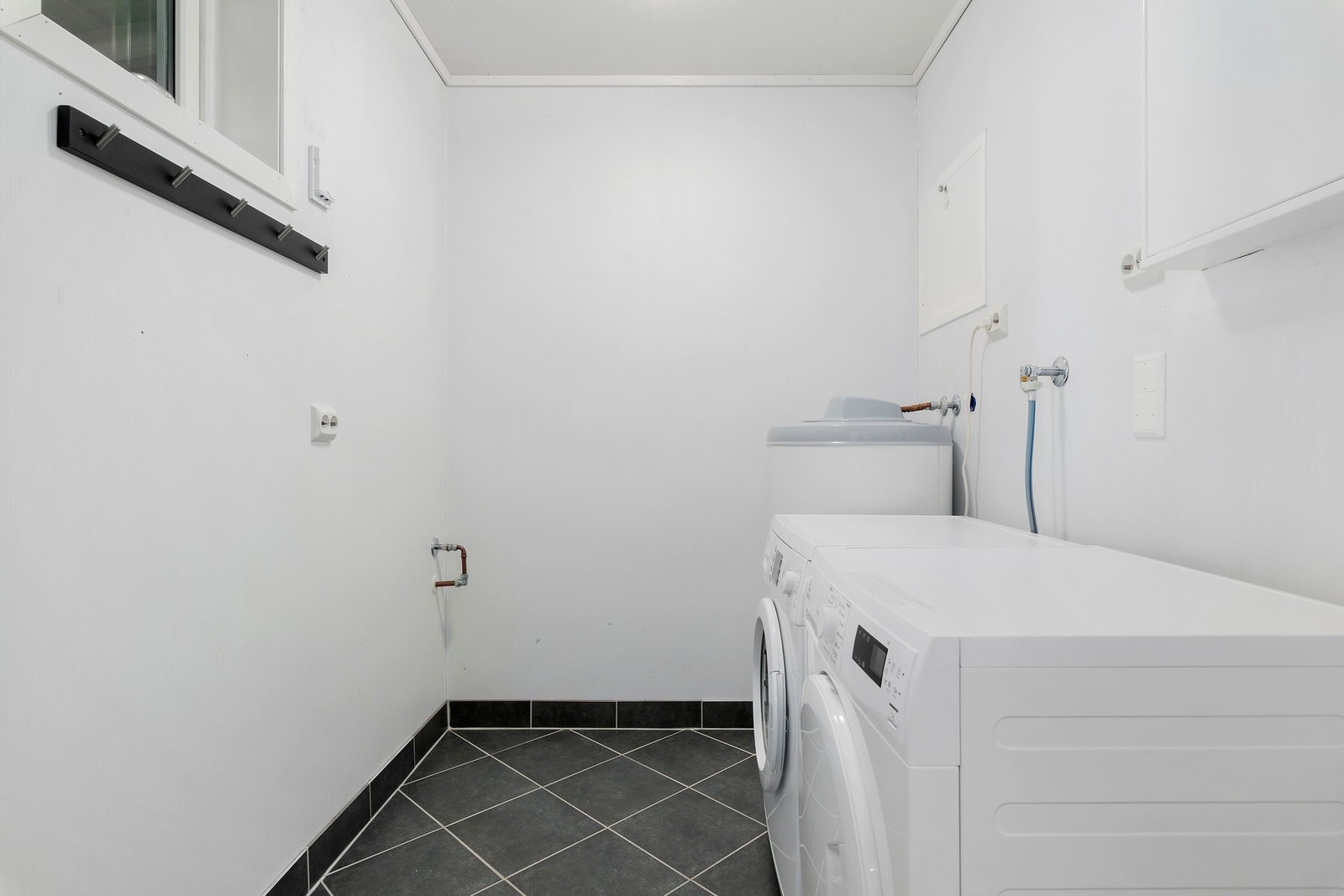 Boligen har eget vaskerom i hovedplan. Galleribilde