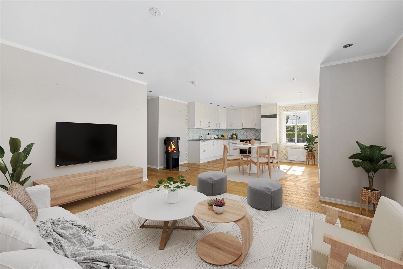 Stuen fremstår som innbydende og moderne, med stilrene overflater og en gjennomført fargepalett som gir en lun og harmonisk atmosfære. Galleribilde