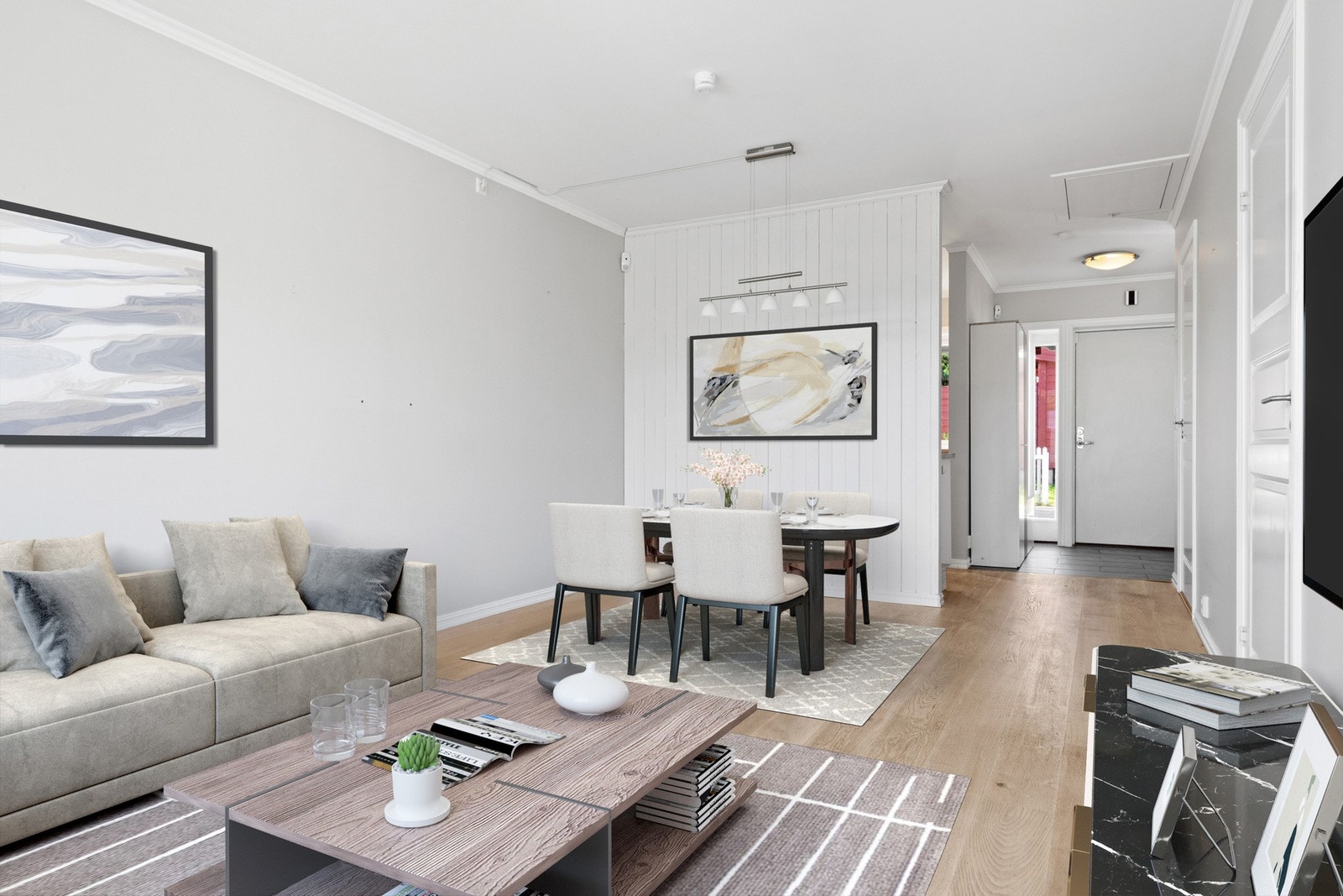 Stuen er naturlig inndelt i ulike soner, og nærmest kjøkkenet passer det fint å innrede med spisebord. Galleribilde