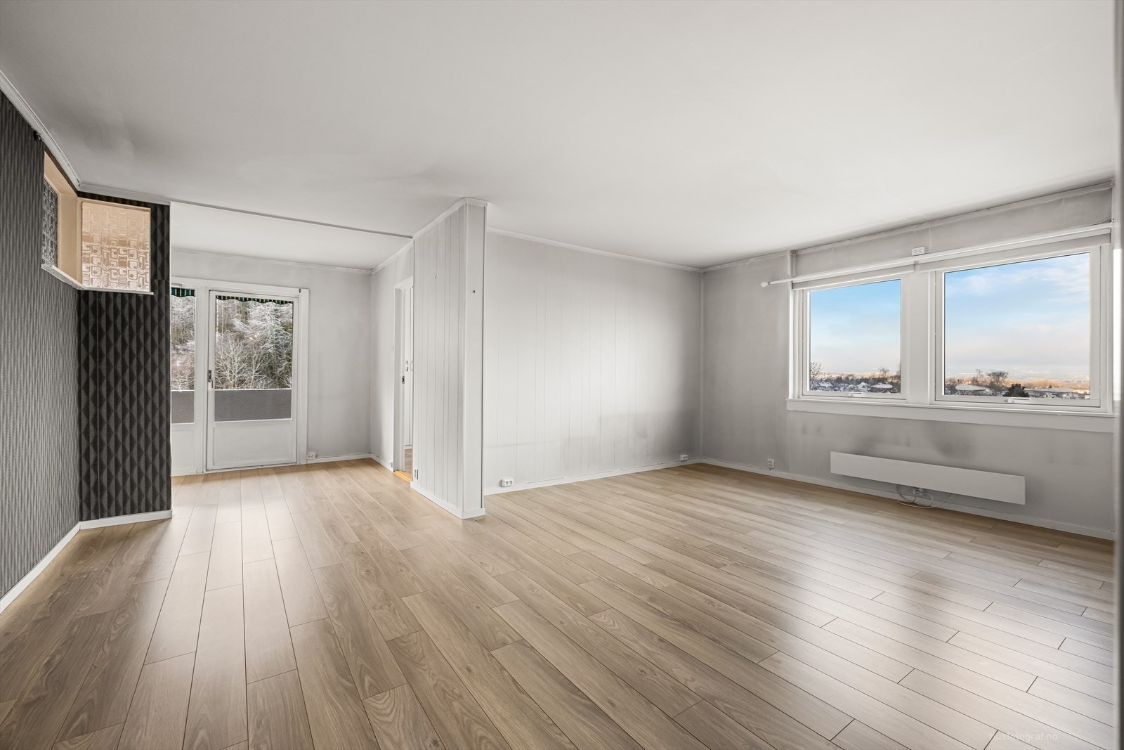 Stuen leder inn til leilighetens kjøkken. Galleribilde