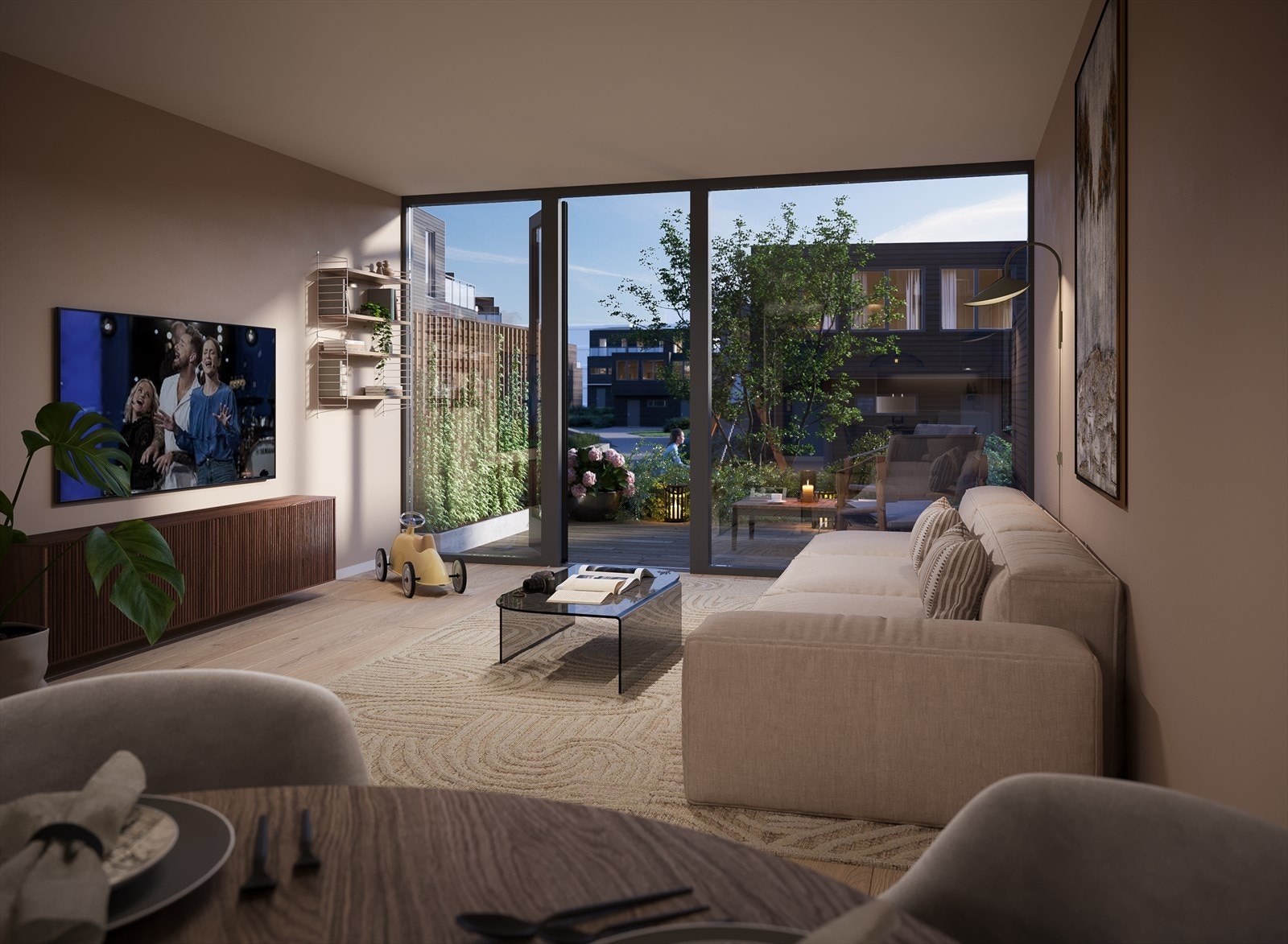 Stuen er plassert i første etasje, i åpen løsning med et lekkert kjøkken - et herlig oppholdsrom hvor familien kan møtes til matlaging, måltider og bare være sammen. Illustrasjonsbilde - avvik vil forekomme! Galleribilde