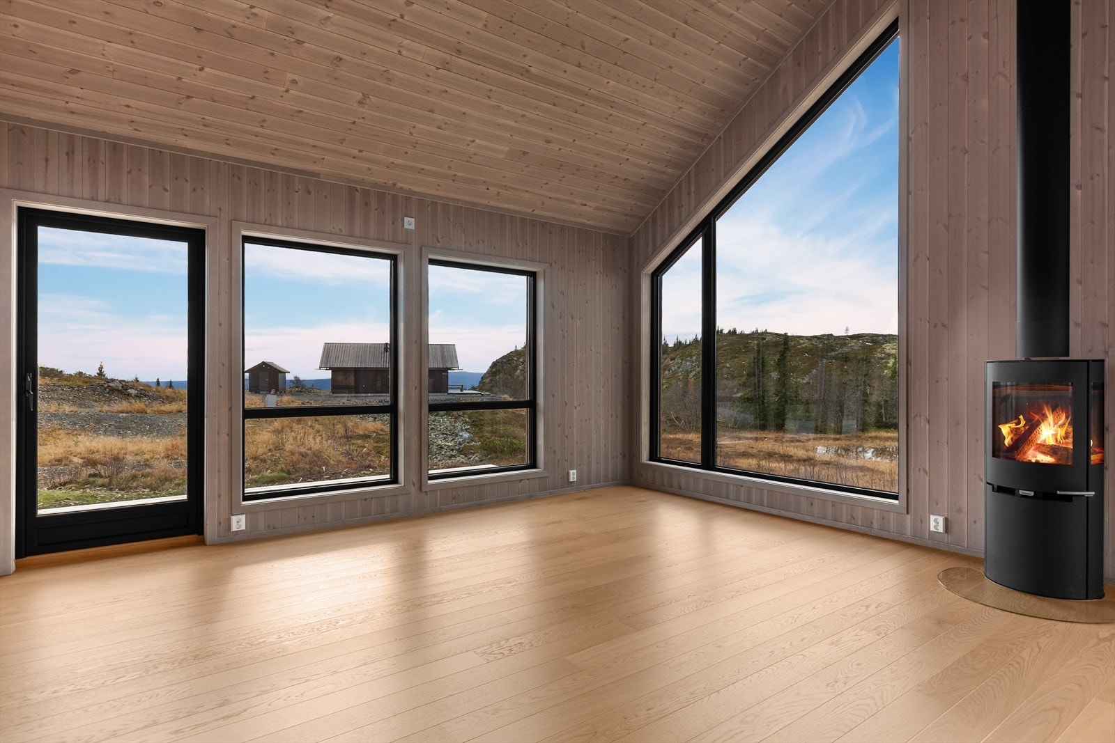 Her er det lyst og luftig med god takhøyde og mange flotte vinduer som strekker seg nærmest fra gulv til tak. Galleribilde