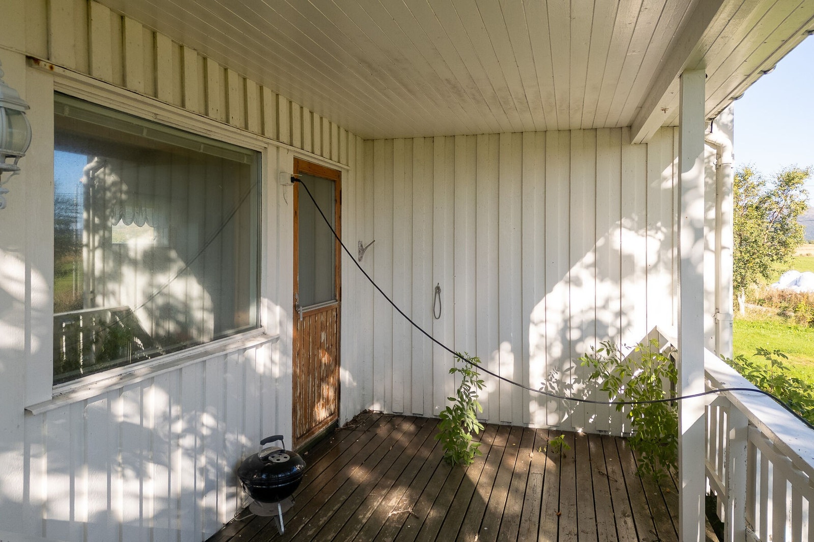 Overbygd terrasse vendt mot sør. Galleribilde