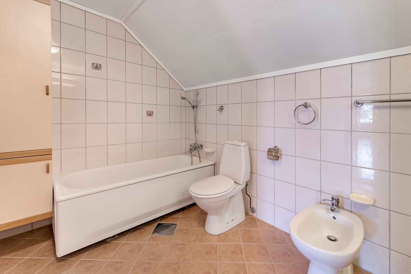 Flislagt gulv med sluk Galleribilde