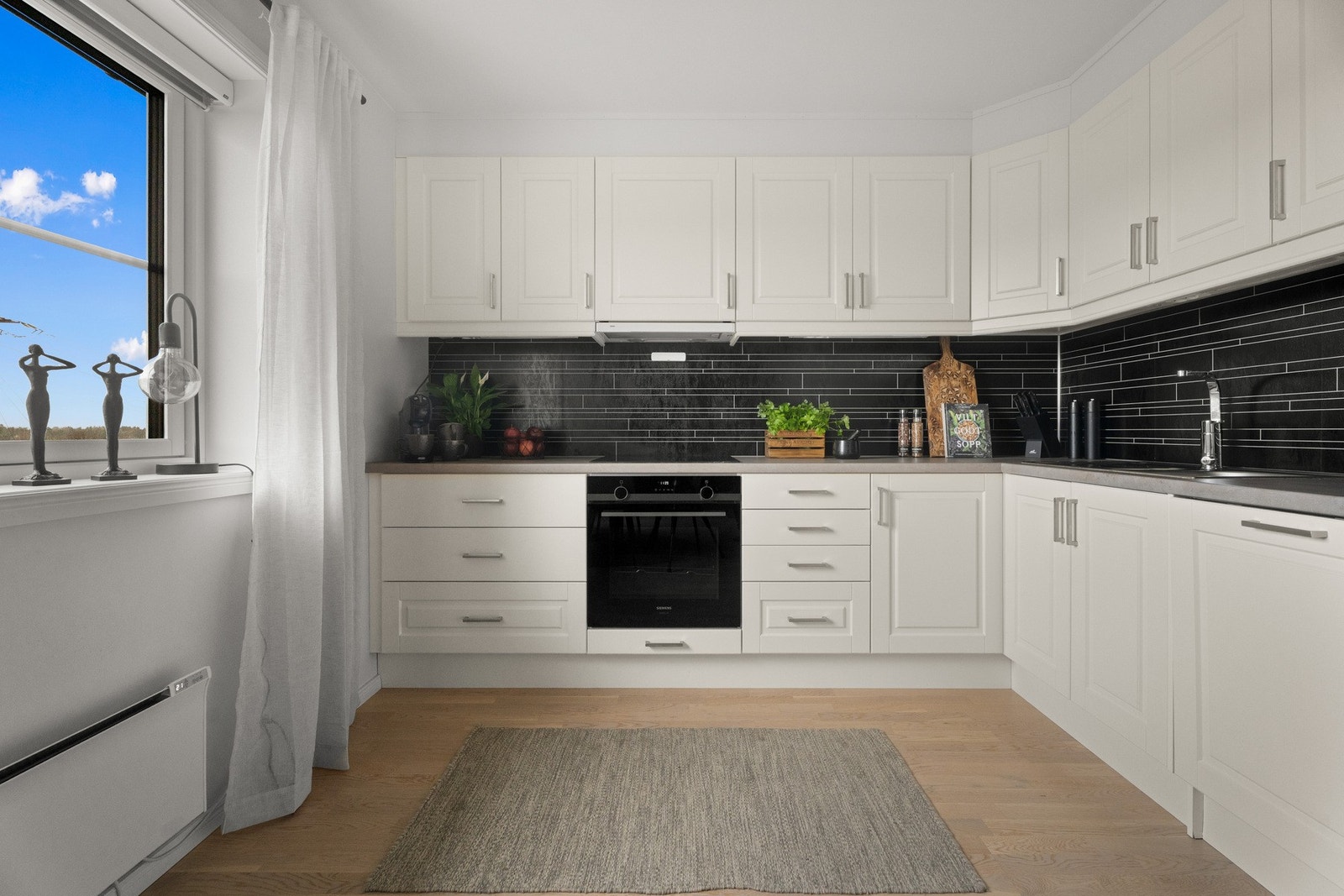 Det er integrert stekeovn og oppvaskmaskin - masse skap- og benkplass! Galleribilde