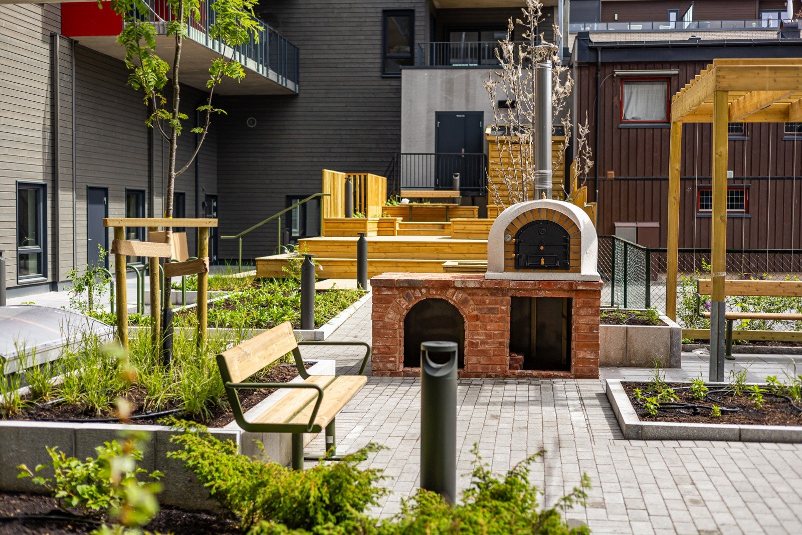 I felles atrium er det en pizzaovn for felles glede. Galleribilde