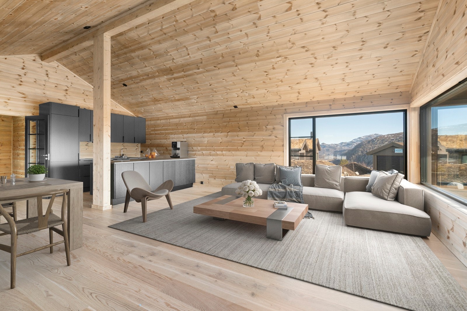 Romslig stue/kjøkken med god takhøyde, ildsted og store vindusflater. Digital stylet. Galleribilde