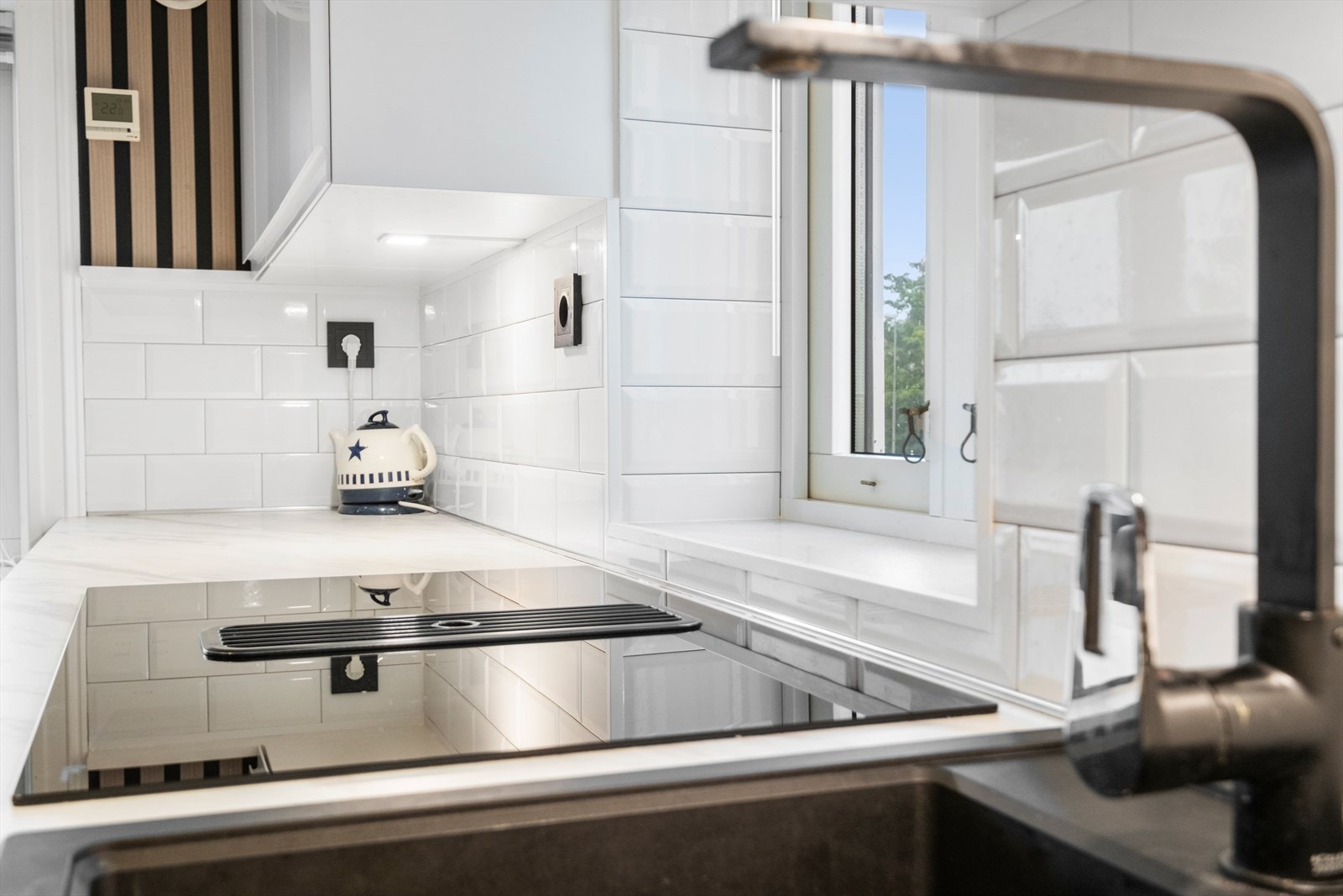 Det er integrert kullfilterventilator i koketopp. Galleribilde