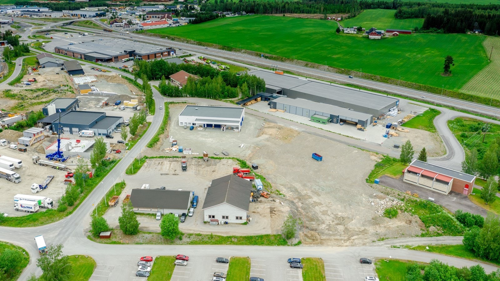 Visualisering eiendom Leinskogen mot E6 - kun dronefoto.jpg Galleribilde