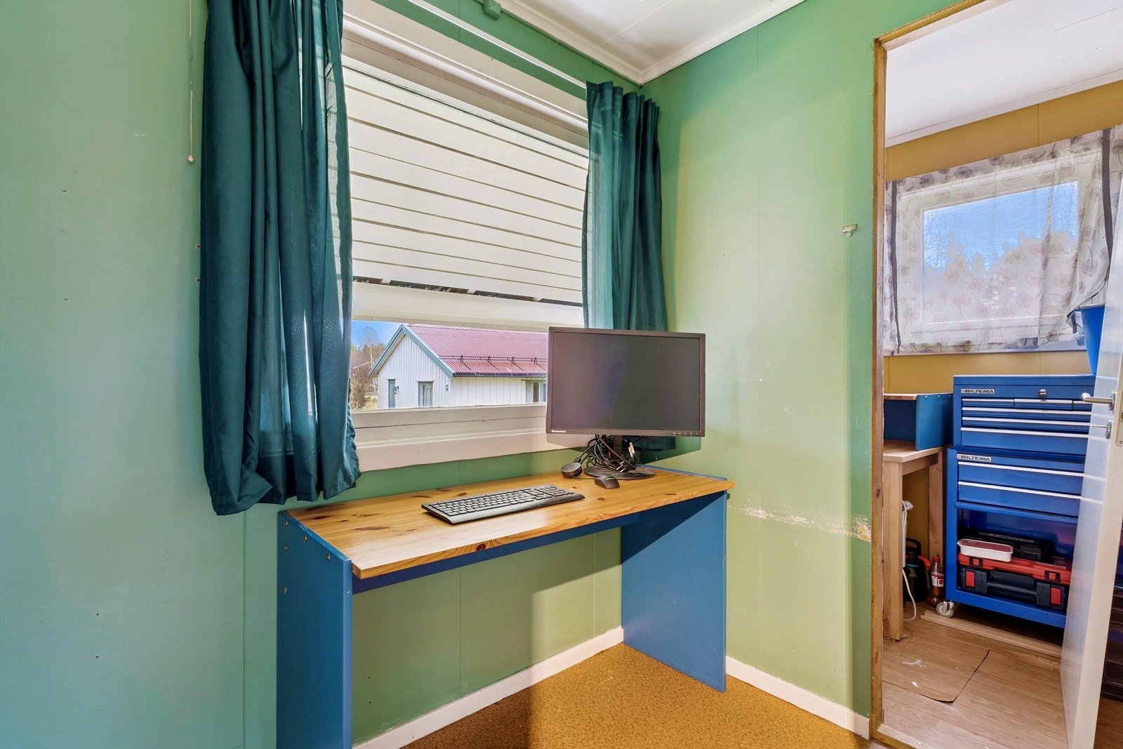 Etasjen inneholder også et praktisk arbeidsrom. Galleribilde