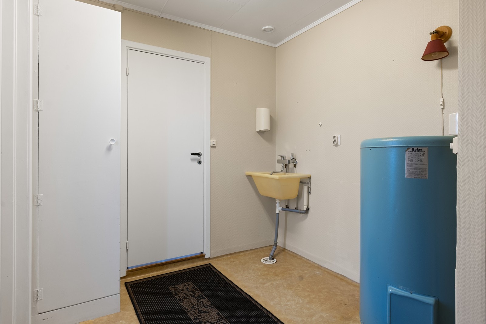 Boligen har et praktisk vaskerom. Galleribilde