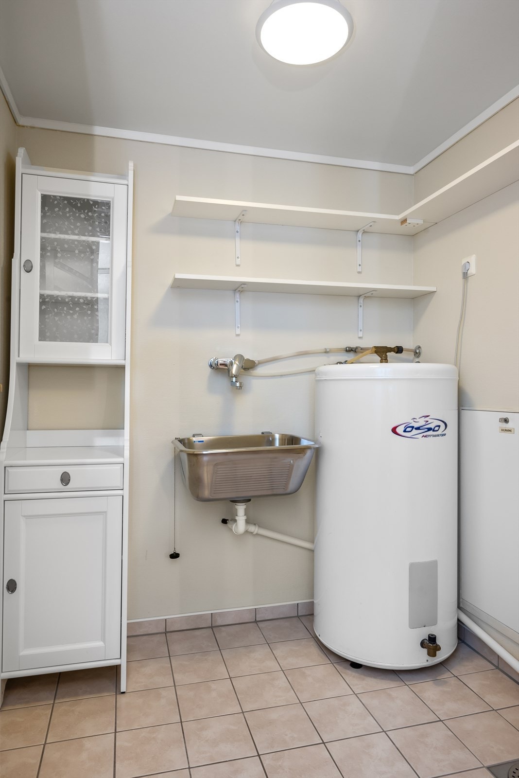 Leiligheten har også et eget vaskerom Galleribilde