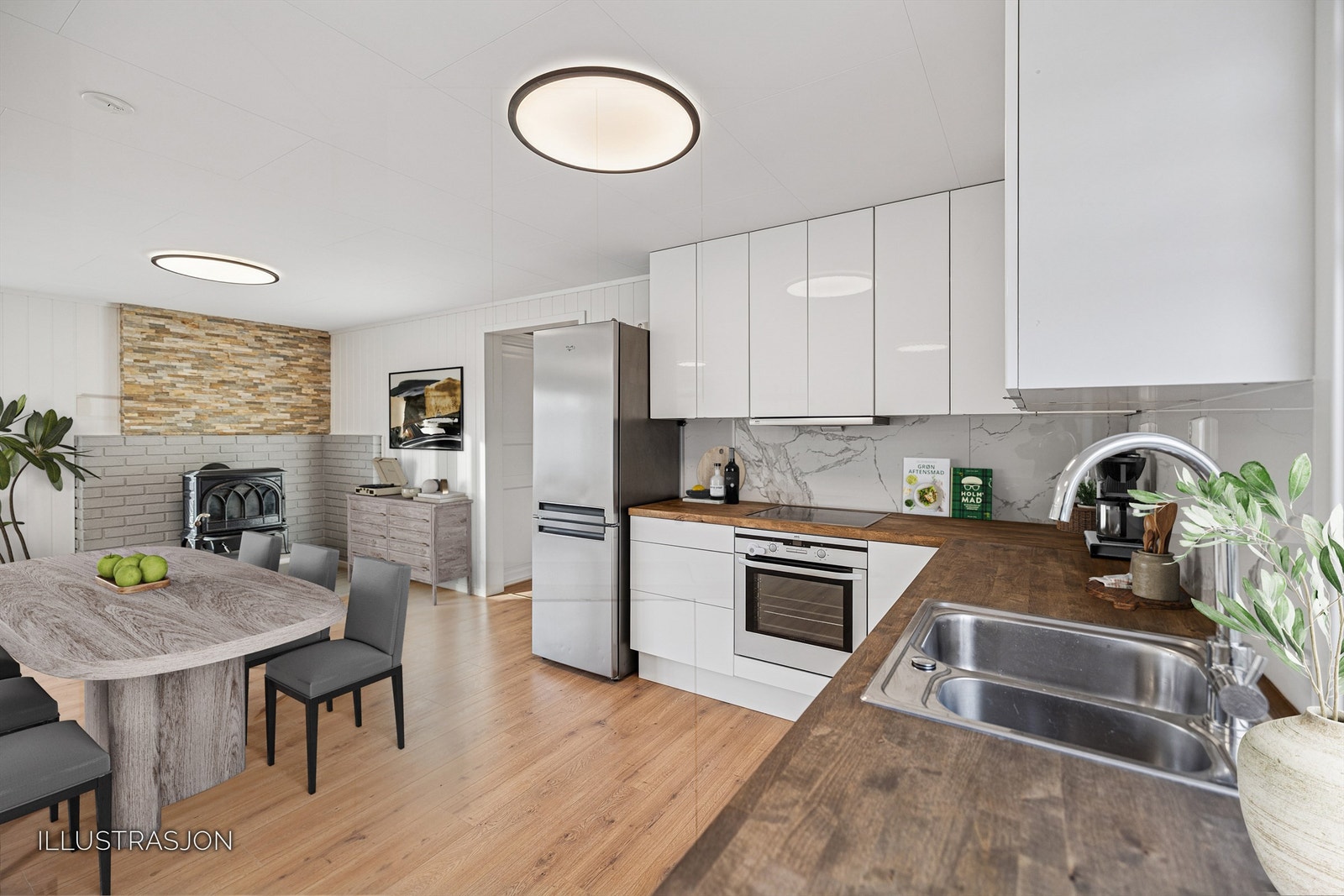 KjøkkenKjøkkeninnredning fra Ikea med benkeplate i heltre og integrerte hvitevarer. Galleribilde