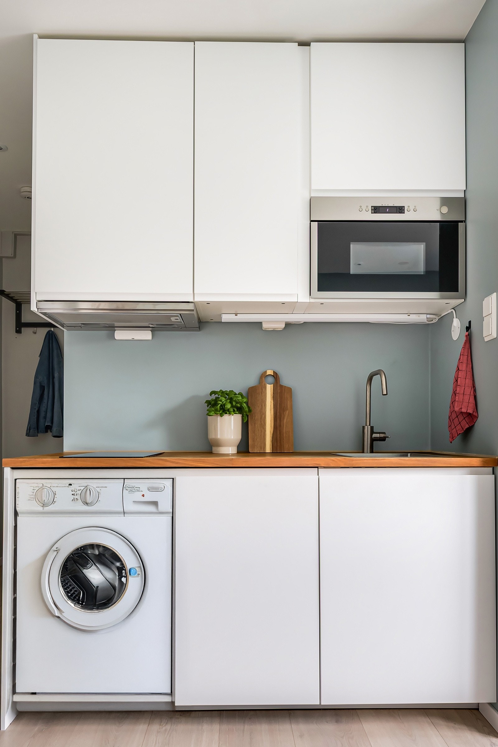 Vaskemaskinen er integrert i kjøkkeninnredningen. Galleribilde