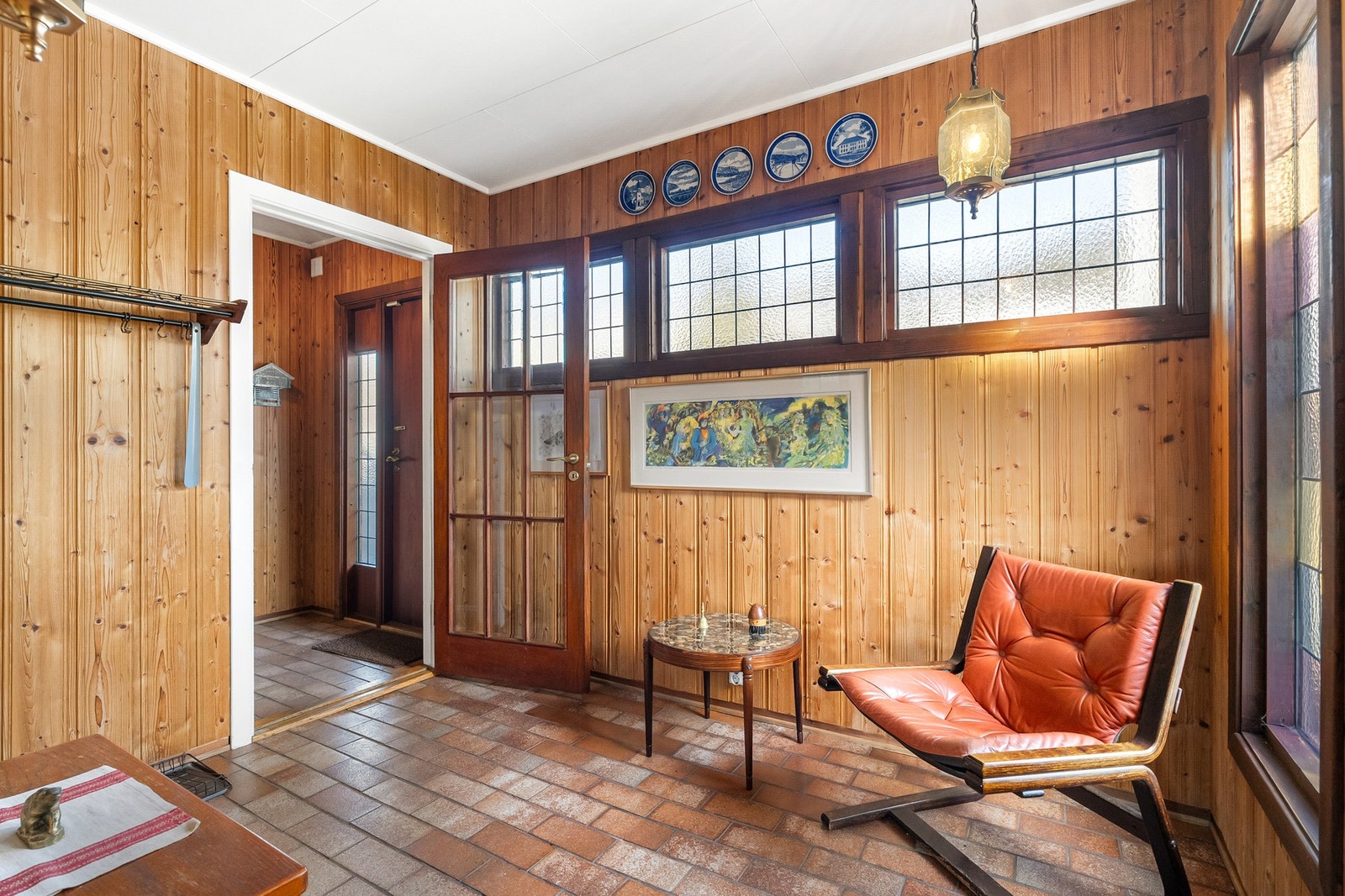 Flislagt vindfang og gang. Galleribilde