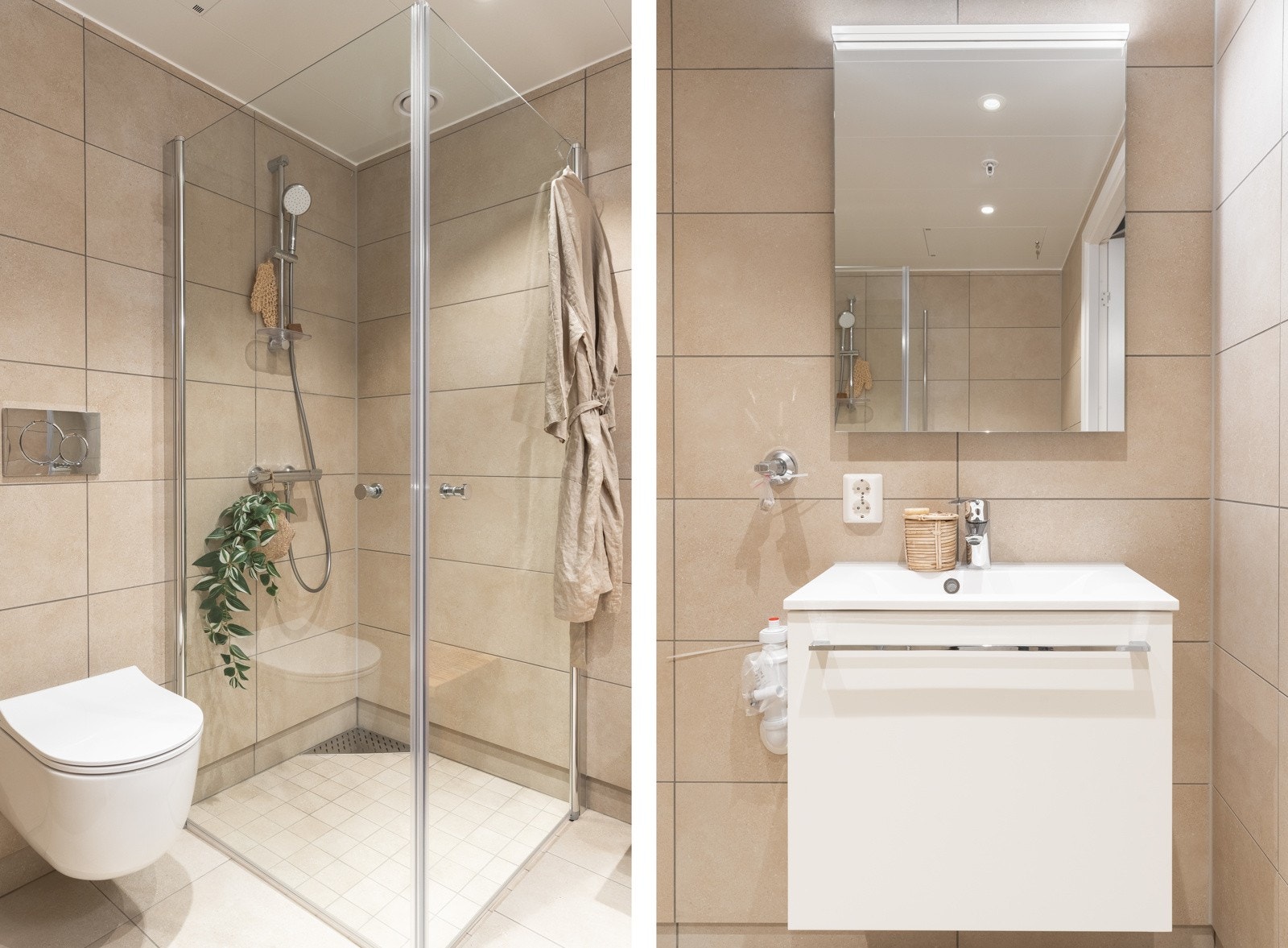 Romslig dusjhjørne med glassvegger, vegghengt toalett, vegghengt skap med ovenpåliggende servant, samt speil med lys. Galleribilde