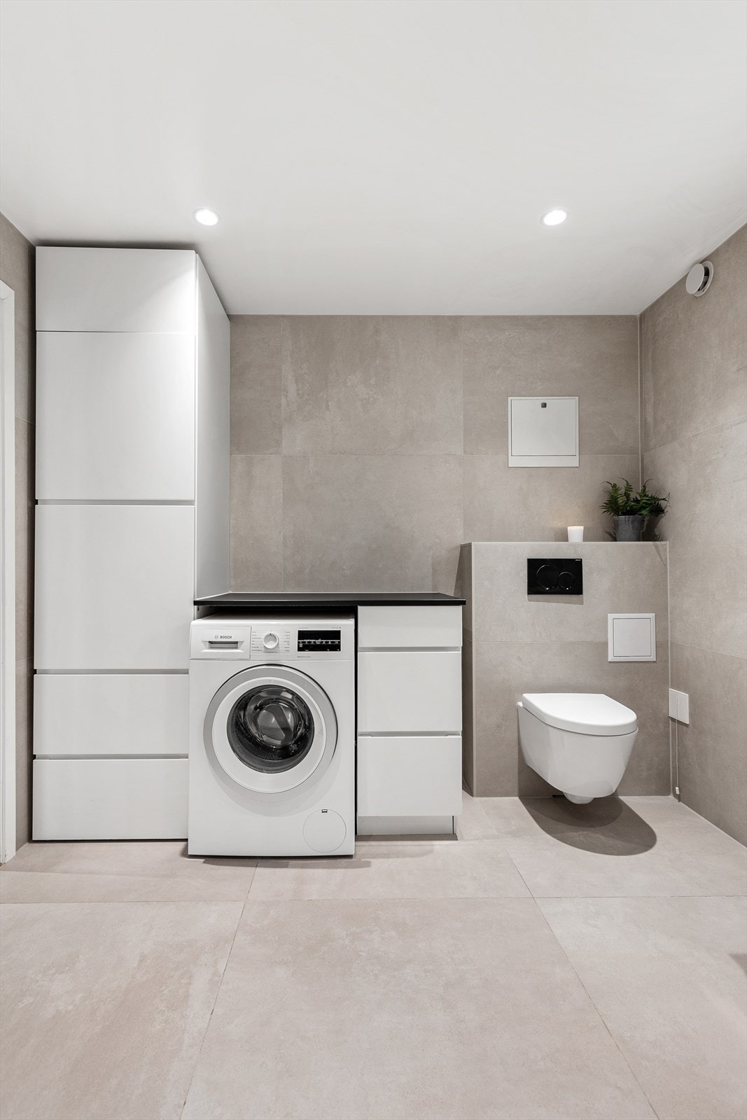 Her er det praktiske oppbevaringsløsninger som gjør klesvasken enklere. Galleribilde